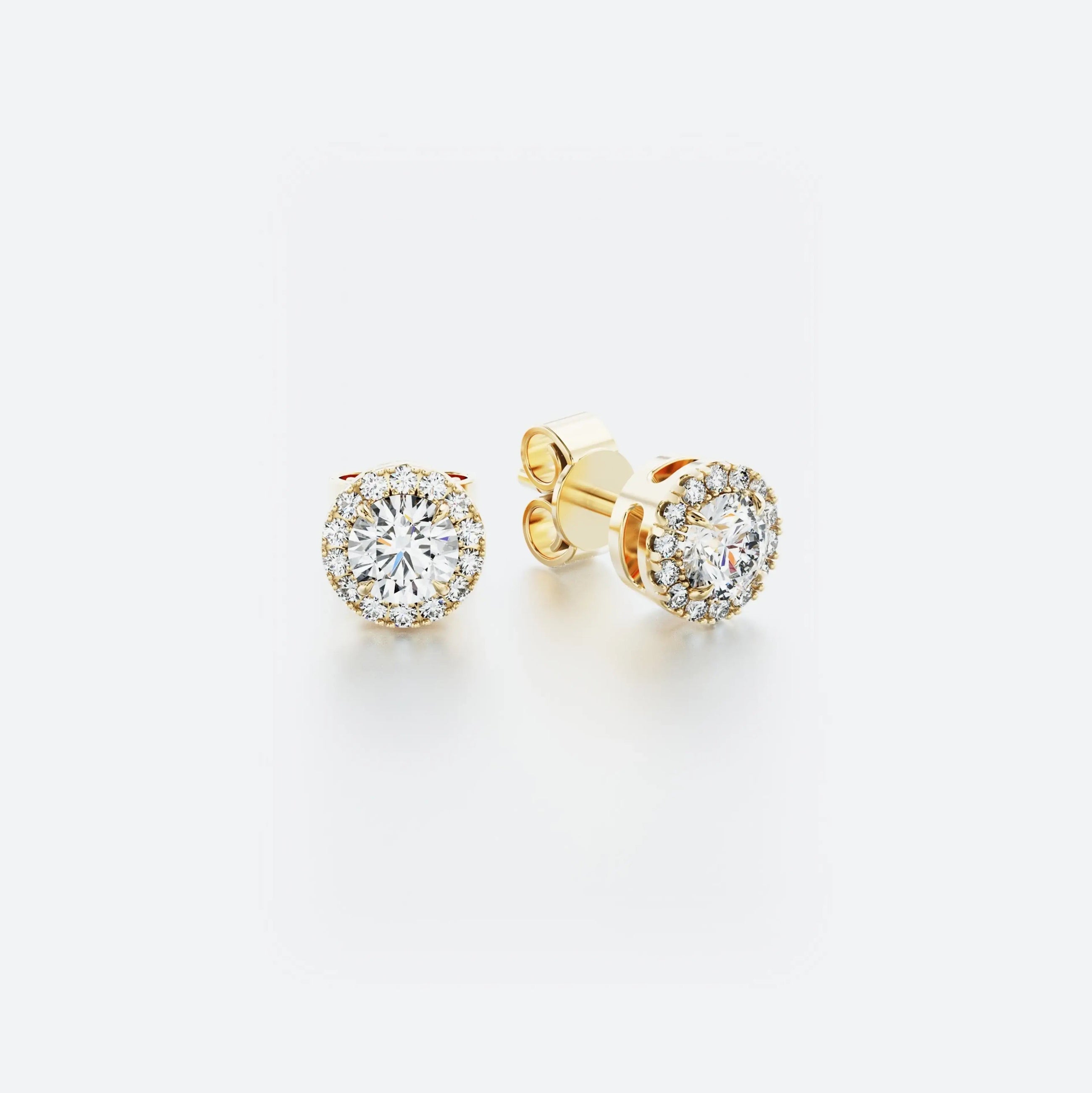 Halo stud diamond earrings in 14k yellow gold featuring a central diamond surrounded by a delicate halo of pavé-set diamonds, with a total carat weight of 0.30 ct.