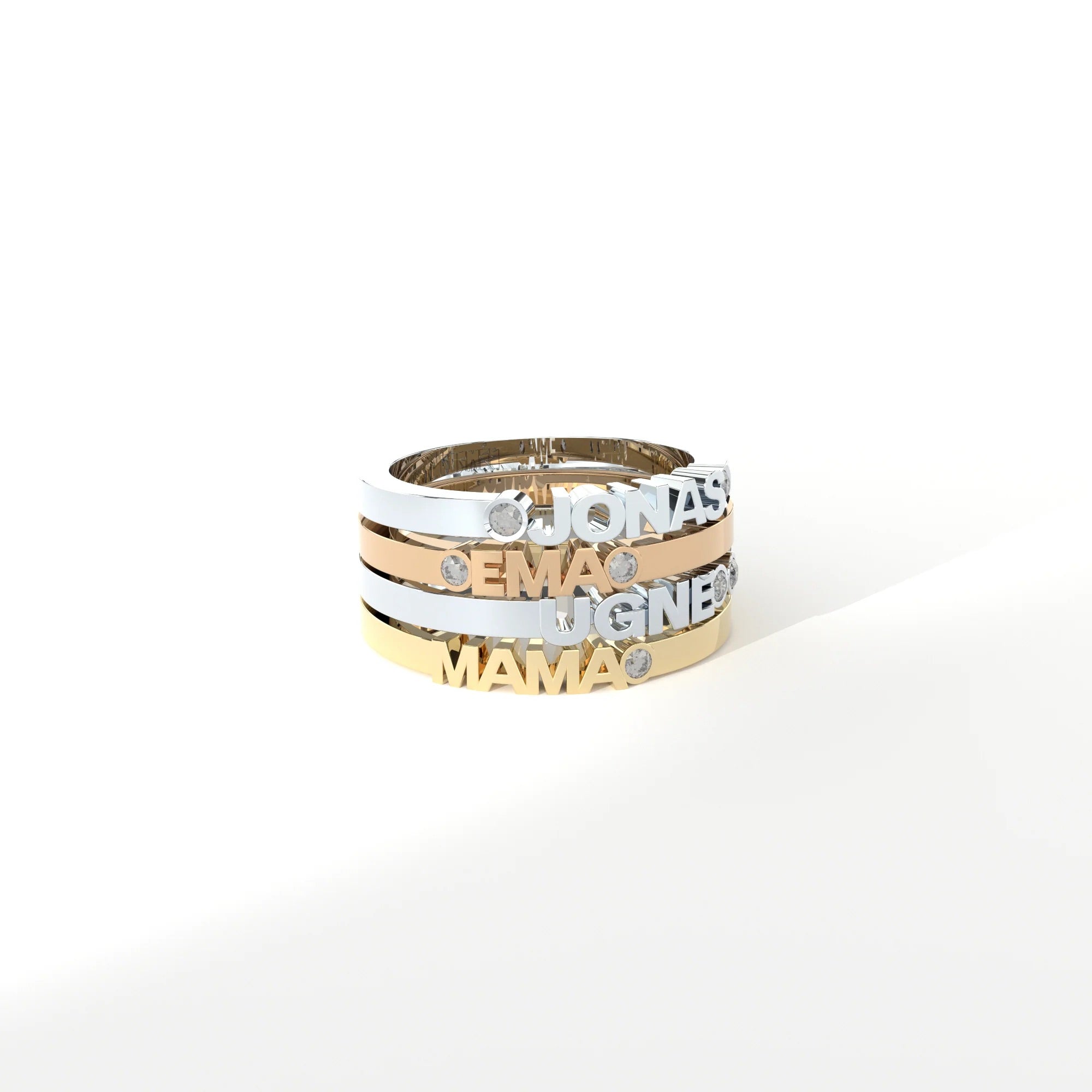 Custom-made gold rings featuring a bespoke name by Formes.