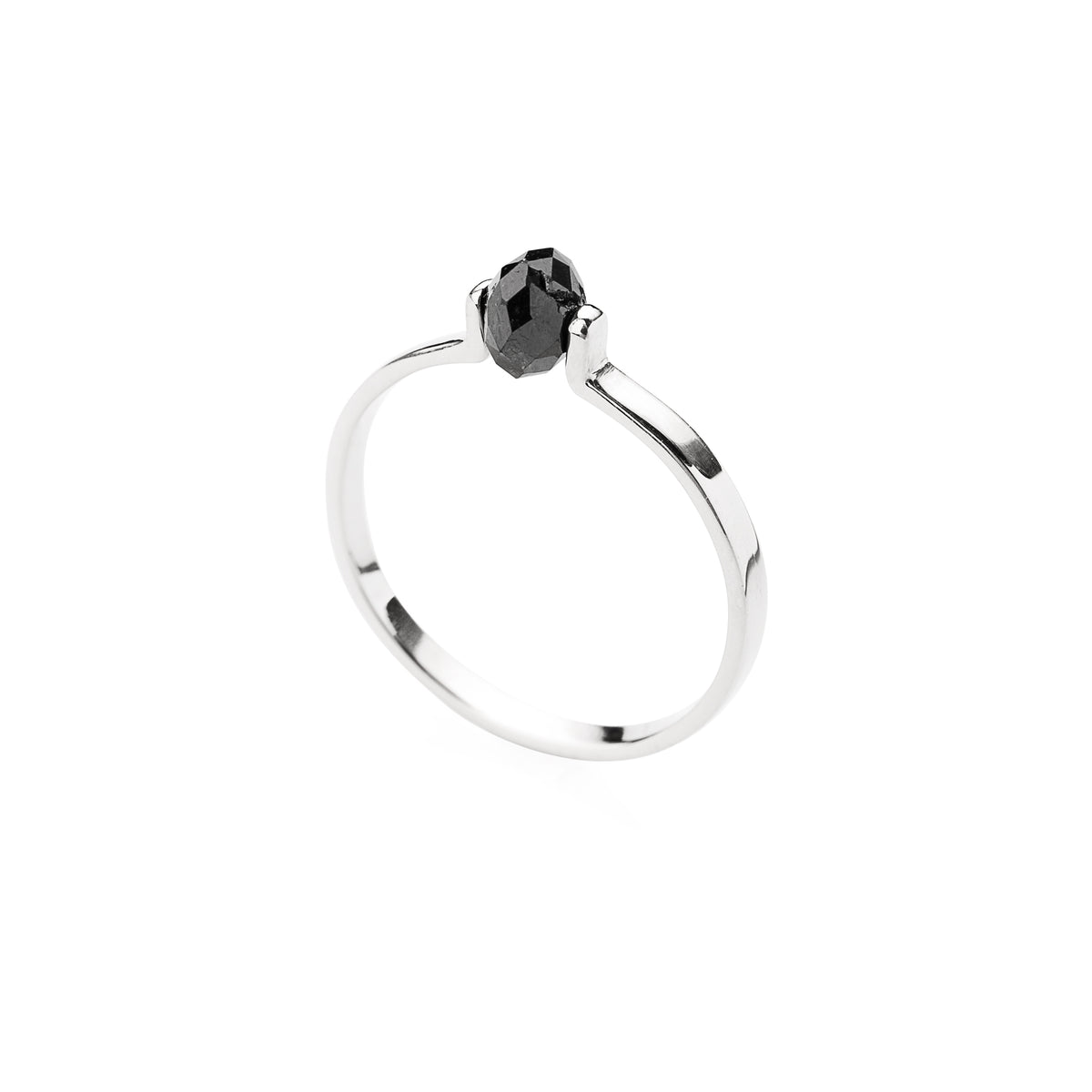Gold ring with a black faceted diamond on a white background