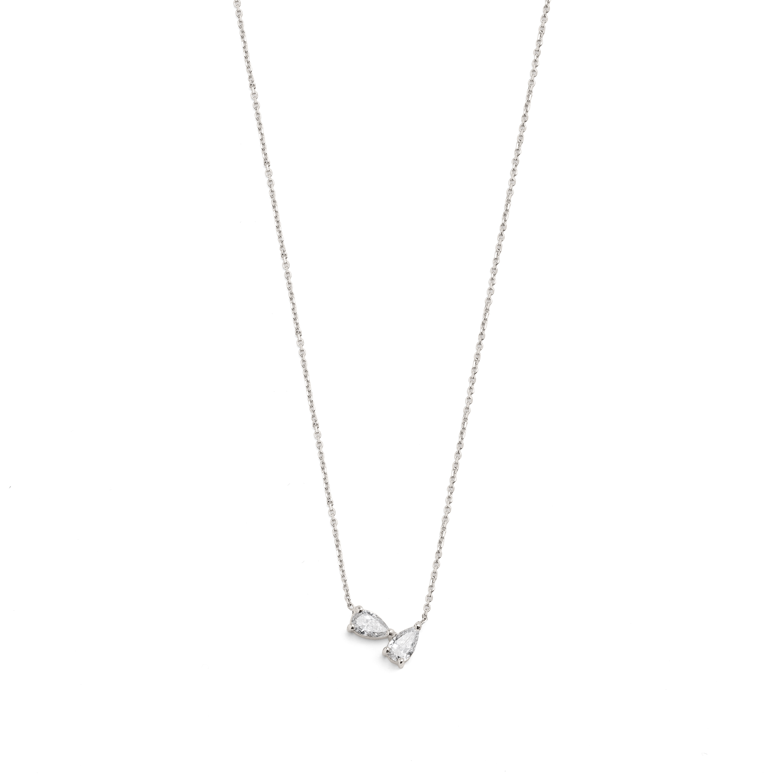 A white gold necklace with two pear-shaped diamonds, displayed against a white background.