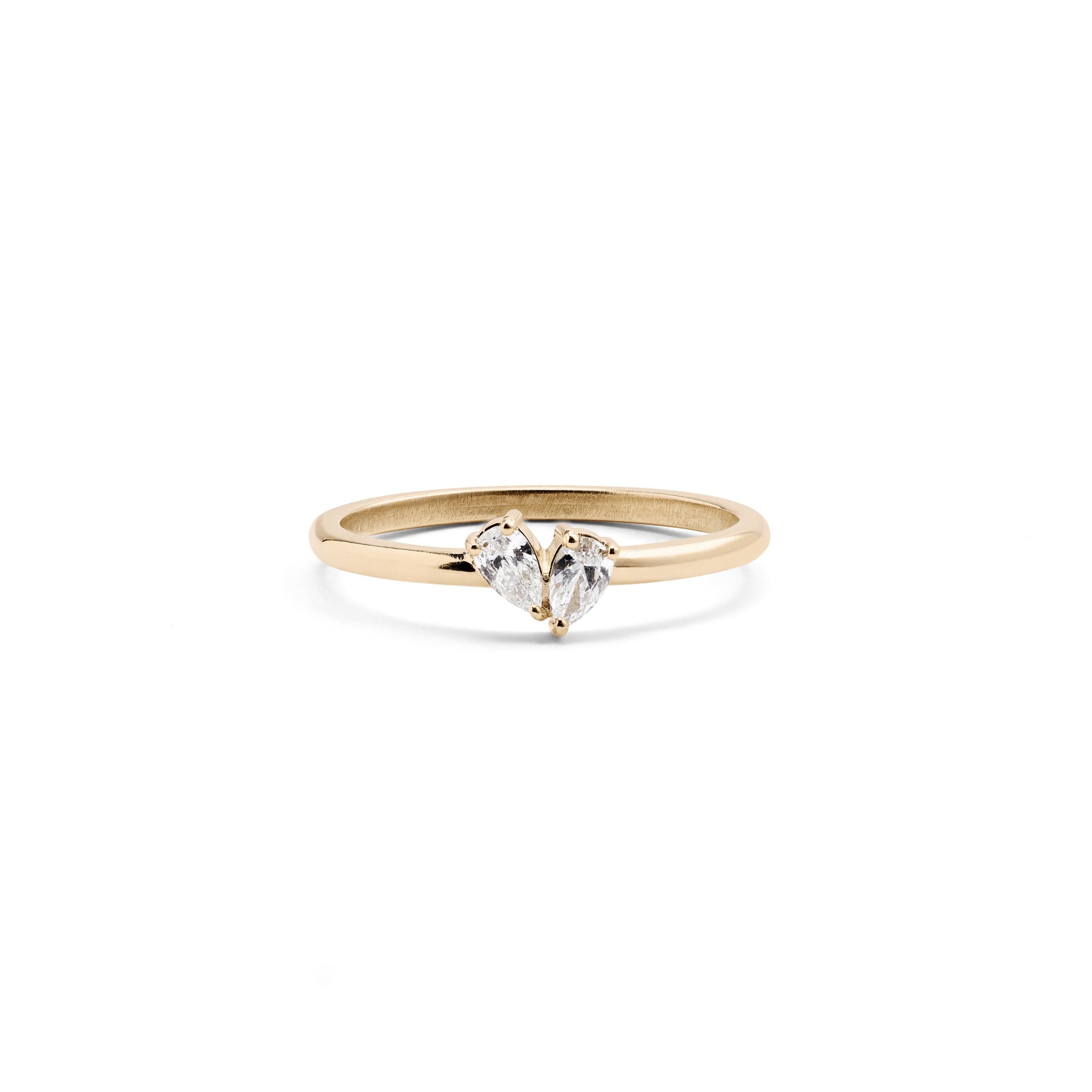 A 14k yellow gold ring with two pear-shaped diamonds set in the band.