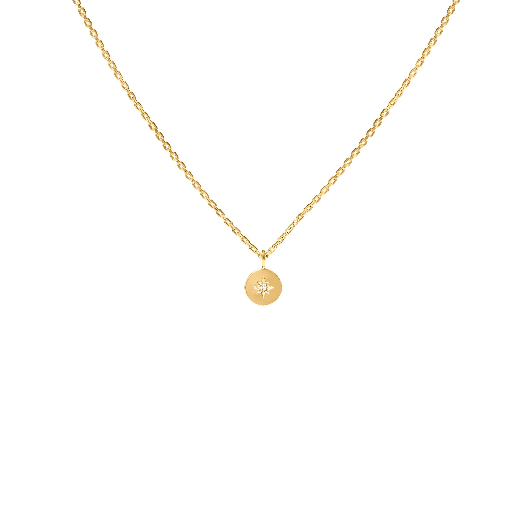 Gold necklace with a round pendant on a white background