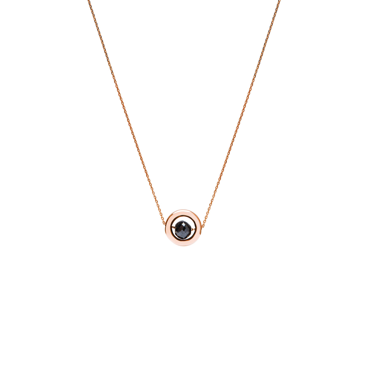 A delicate rose gold chain necklace featuring a small circular pendant with a gold outer ring and a dark, nearly black, faceted diamond, shown against a plain white background.