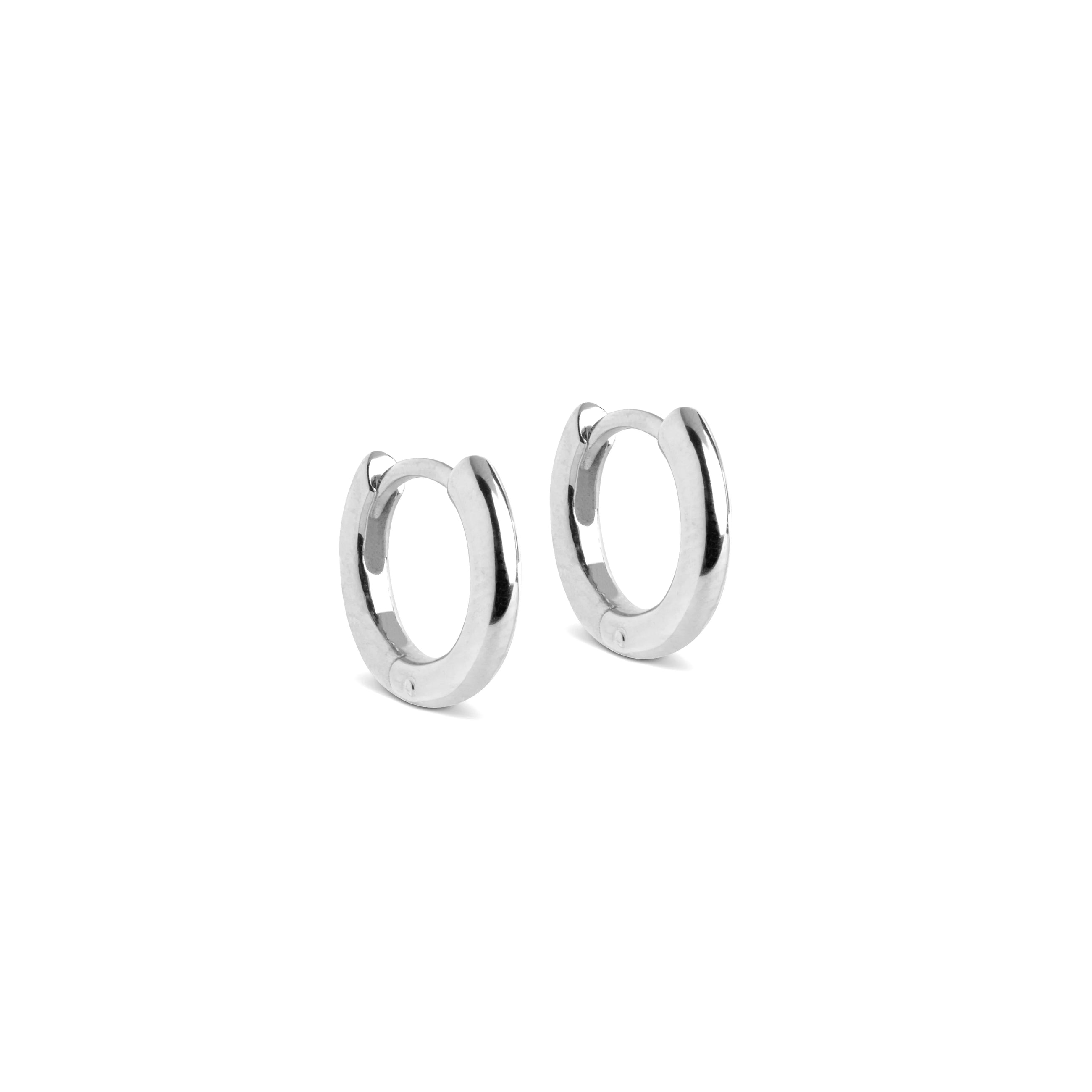 Pair of silver hoop earrings on a white background