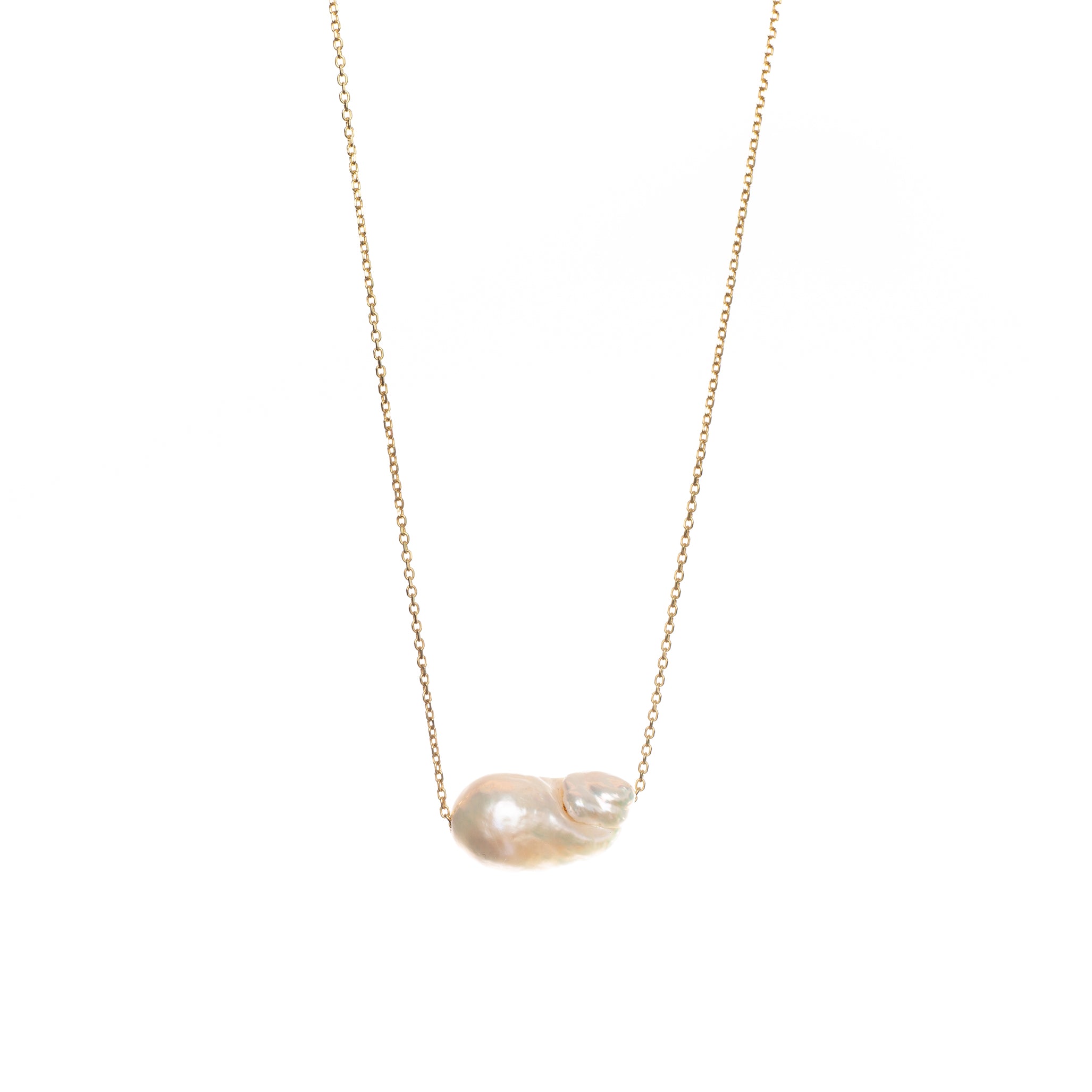 Unique baroque-shaped freshwater pearl suspended from a delicate yellow gold chain.