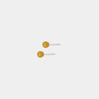 Silver stud earrings, featuring Baltic amber by Adele Notes.