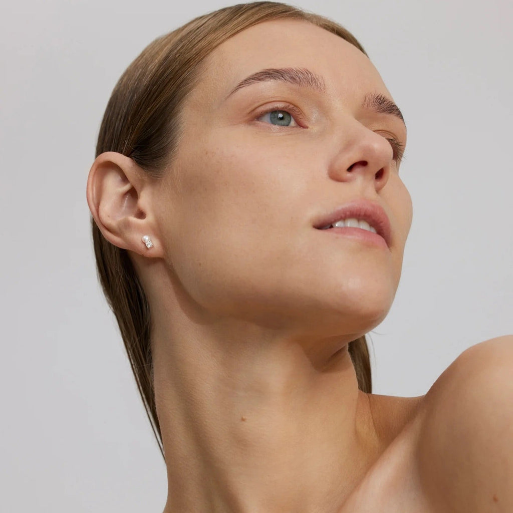 Close-up of a woman's face with a neutral background