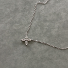 Delicate flower pendant crafted in 14k white gold, adorned with marquise-cut diamonds.