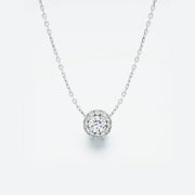 White gold necklace with a round diamond pendant on a light gray background