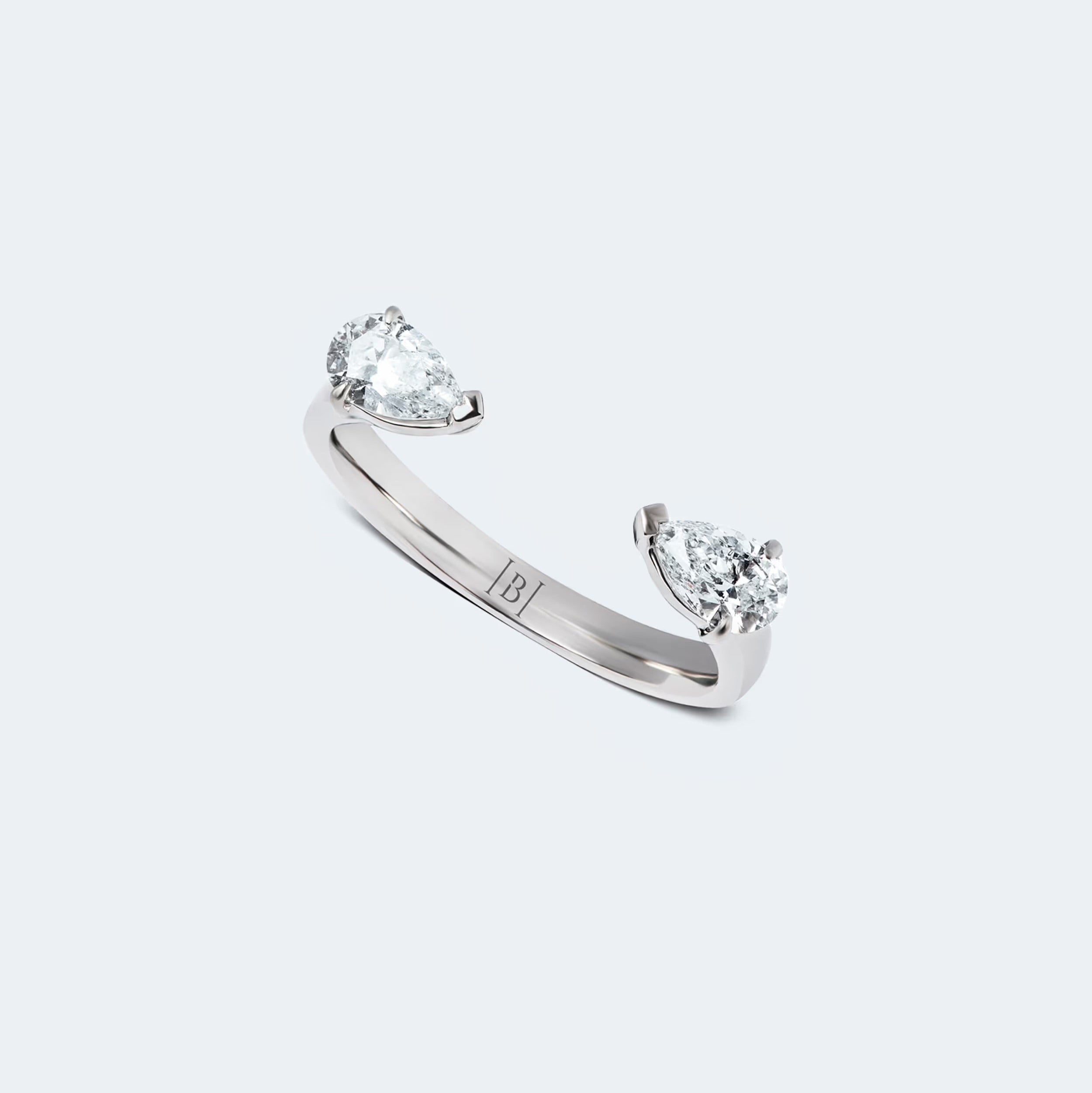 Pear-Shaped diamond hug ring featuring two pear-shaped diamonds gracefully set on an open band, with a total carat weight of 0.60 ct.