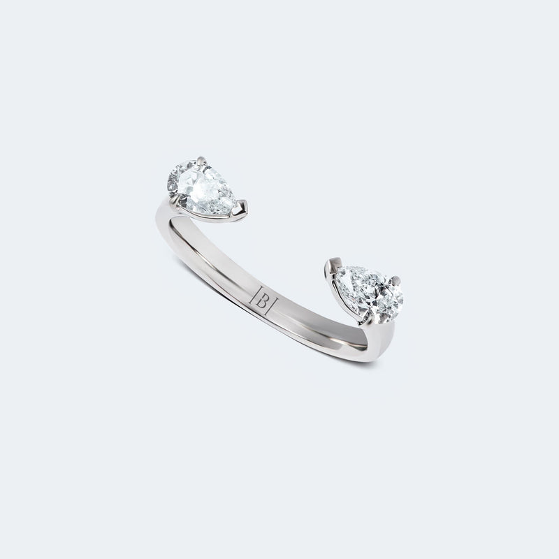 Pear-Shaped diamond hug ring featuring two pear-shaped diamonds gracefully set on an open band, with a total carat weight of 0.60 ct.
