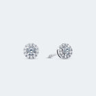 A pair of 14k white gold halo stud diamond earrings with a central diamond surrounded by a halo of pavé-set diamonds.