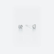 Pair of classic stud earrings crafted from 14k white gold, featuring brilliant diamonds with a total weight of 0.40 ct.