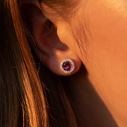 Close up of earring in 14k white gold with round pink topaz and a single row of round brilliant-cut lab-grown diamonds. 
