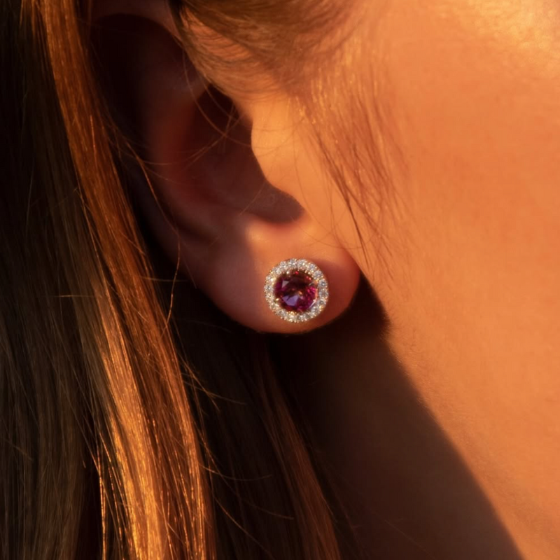 Close up of earring in 14k white gold with round pink topaz and a single row of round brilliant-cut lab-grown diamonds. 
