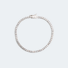 Tennis bracelet created in 14k white gold, featuring a seamless row of brilliant diamonds set along the entire band for a continuous sparkle. 