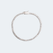 Tennis bracelet created in 14k white gold, featuring a seamless row of brilliant diamonds set along the entire band for a continuous sparkle. 
