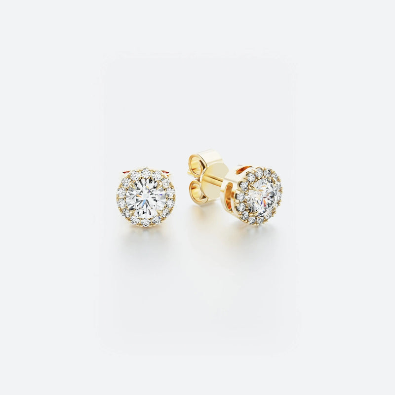 Halo stud diamond earrings in 14k yellow gold featuring a central diamond surrounded by a delicate halo of pavé-set diamonds, with a total carat weight of 0.30 ct.