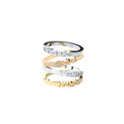 Custom-made gold rings featuring a bespoke name by Formes.