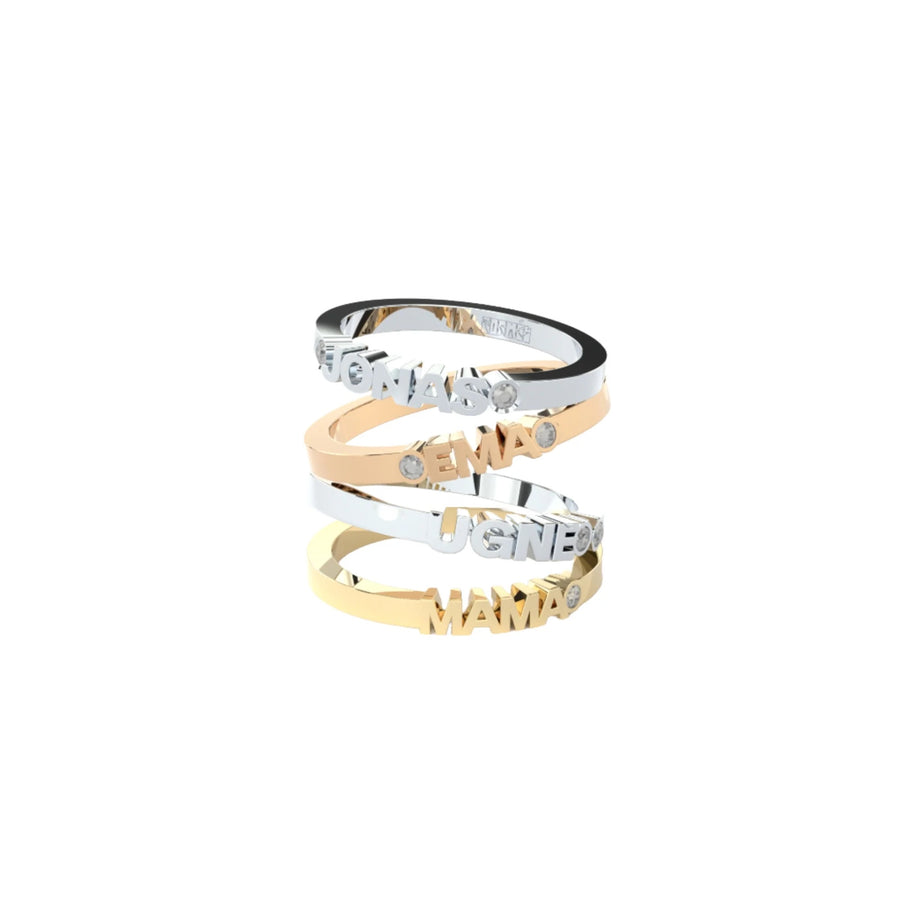 Custom-made gold rings featuring a bespoke name by Formes.