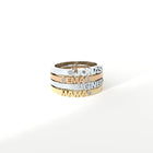 Custom-made gold rings featuring a bespoke name by Formes.