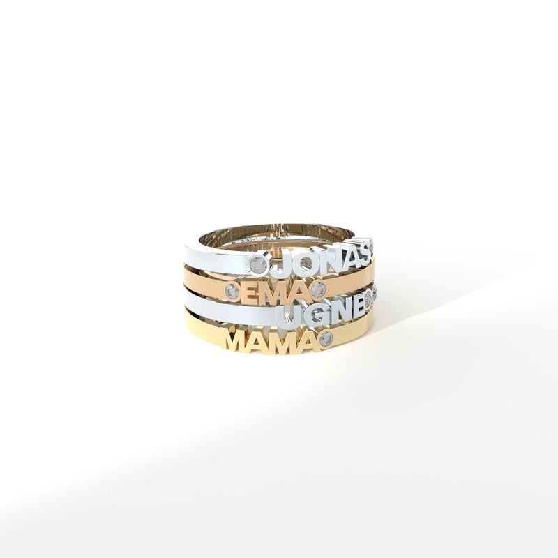 Custom-made gold rings featuring a bespoke name by Formes.