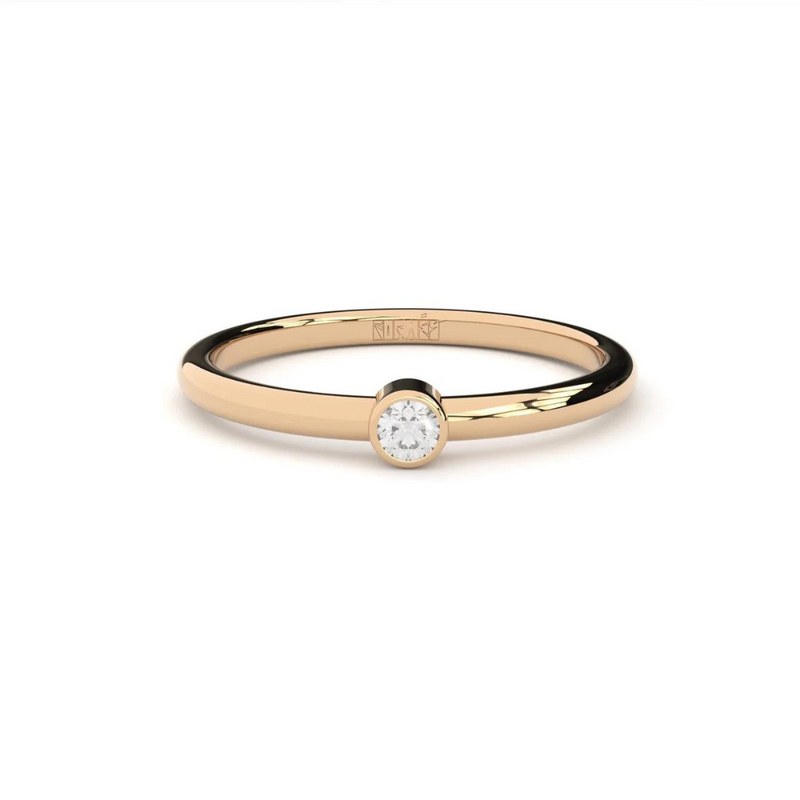 An engagement ring with a single laboratory-made diamond set in a rose gold band