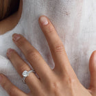 White gold luxurious engagement ring with 2.00 ct central diamond. 