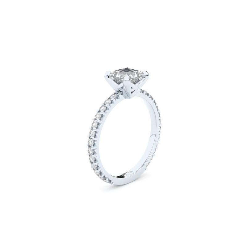 A white gold ring with a large central diamond surrounded by smaller diamonds around the band.
