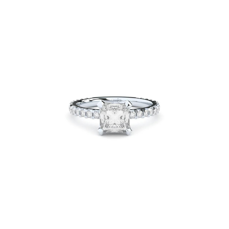 A white gold ring with a large central diamond surrounded by smaller diamonds around the band.