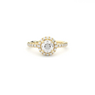 A yellow gold ring with a 0.50 ct central diamond surrounded by smaller diamonds in a halo style setting.