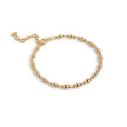 Gold beaded bracelet on a white background