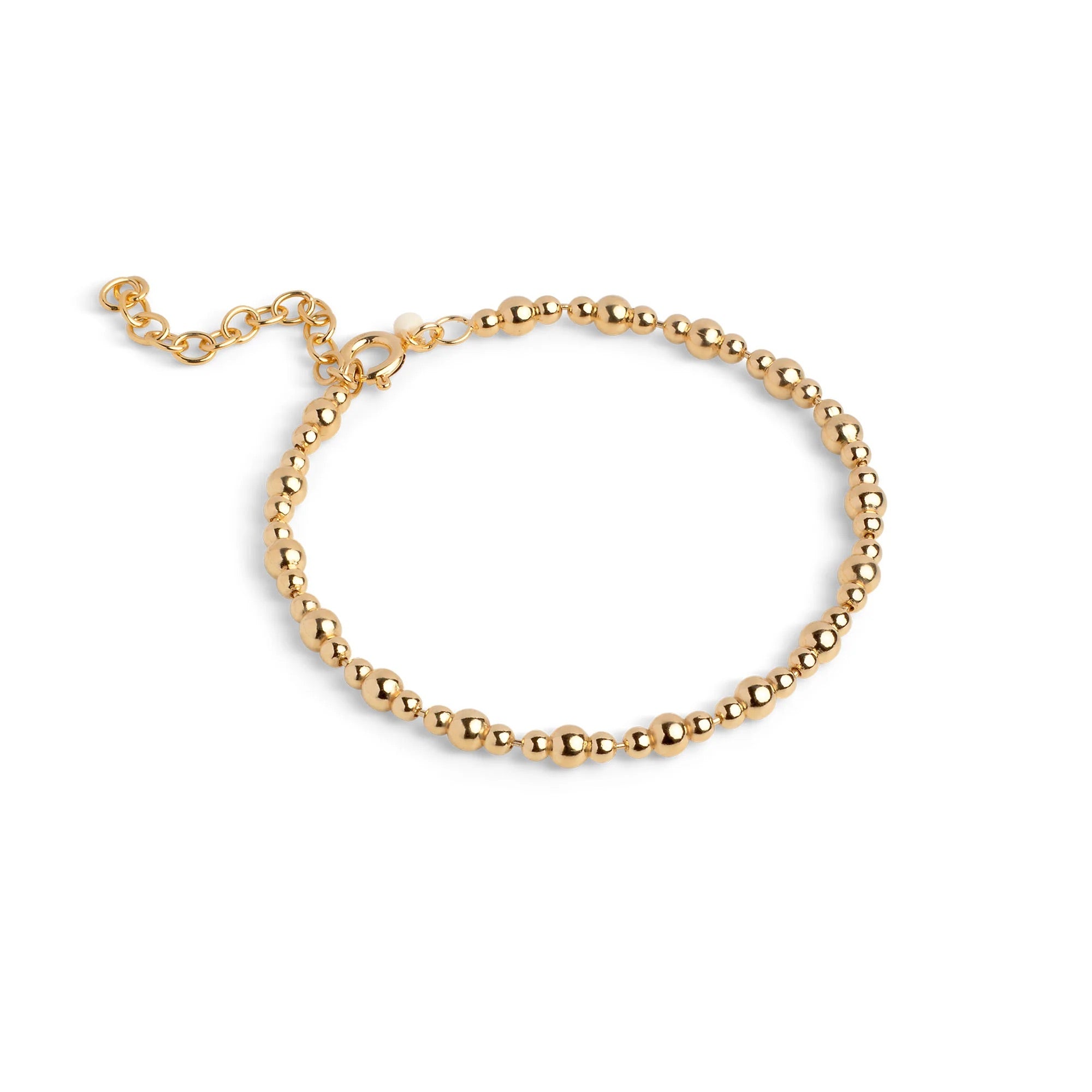 Gold beaded bracelet on a white background