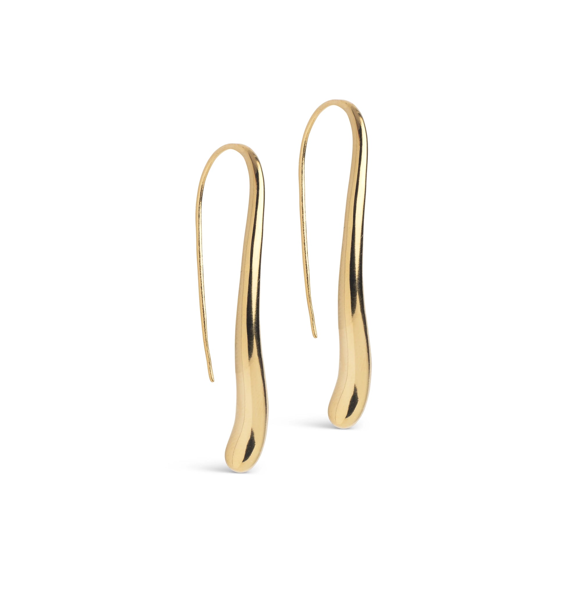 A pair of gold-colored, sculptural drop earrings with a smooth, organic wavy silhouette, displayed on a clean white background.