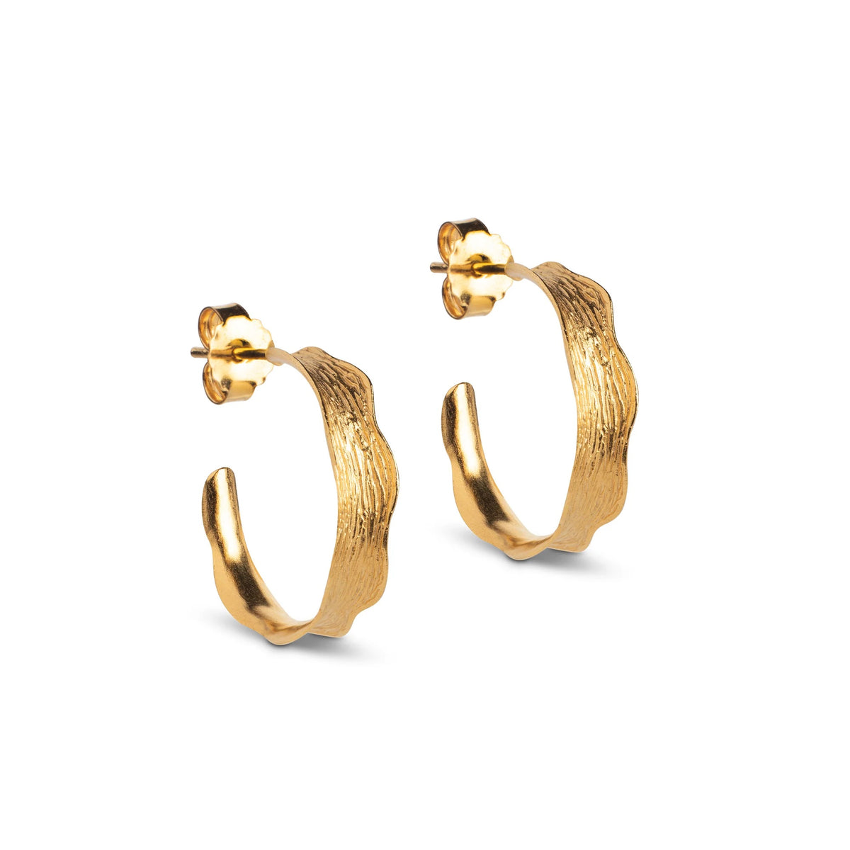 A pair of textured gold hoop earrings with a wavy, organic edge and post-back closures, shown on a clean white background.