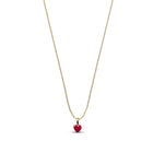 A delicate gold chain necklace featuring a small, polished red heart pendant, presented on a clean white background.