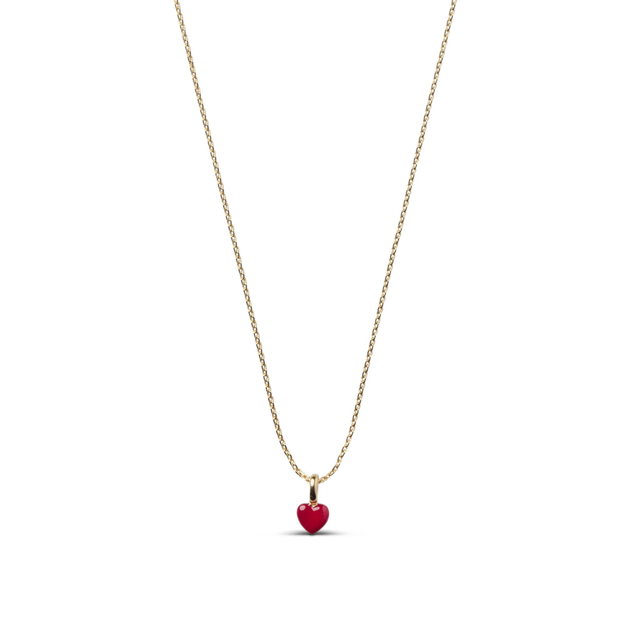 A delicate gold chain necklace featuring a small, polished red heart pendant, presented on a clean white background.