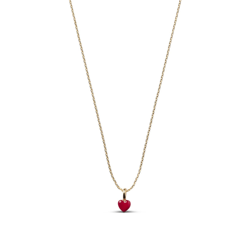A delicate gold chain necklace featuring a small, polished red heart pendant, presented on a clean white background.