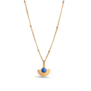 Gold necklace with a blue pendant on a white background