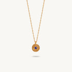 Gold-plated silver chain necklace featuring a round, textured disc pendant with a small blue sapphire set in the center.