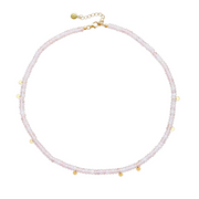A delicate beaded necklace in pale pink quartz with small gold-plated silver accents and a gold-plated chain extender clasp, shown on a plain white background.