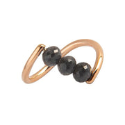 A rose gold ring featuring three faceted dark gray diamond beads set along a curved, open infinity-style band, shown on a plain white background.