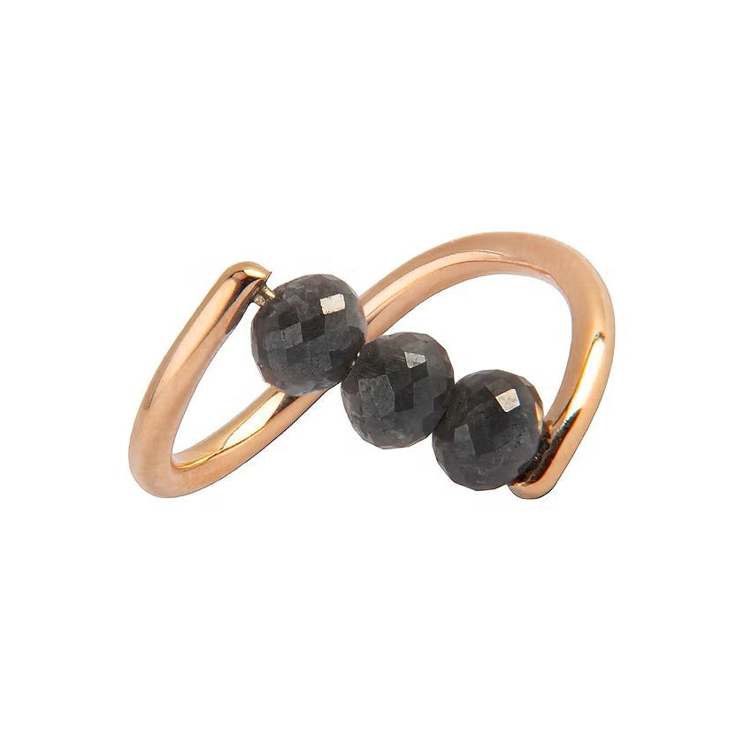 A rose gold ring featuring three faceted dark gray diamond beads set along a curved, open infinity-style band, shown on a plain white background.