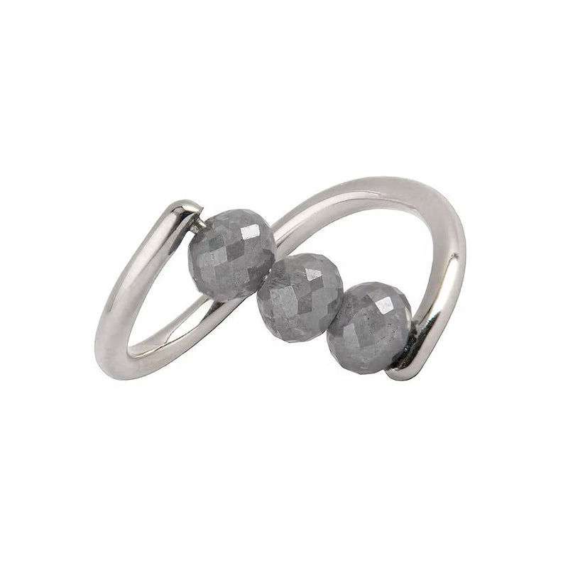 A white gold ring featuring three faceted dark gray diamond beads set along a curved, open infinity-style band, shown on a plain white background.