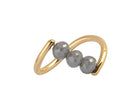 A yellow gold ring featuring three faceted dark gray diamond beads set along a curved, open infinity-style band, shown on a plain white background.