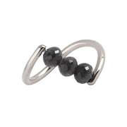 A white gold ring featuring three faceted dark gray diamond beads set along a curved, open infinity-style band, shown on a plain white background.