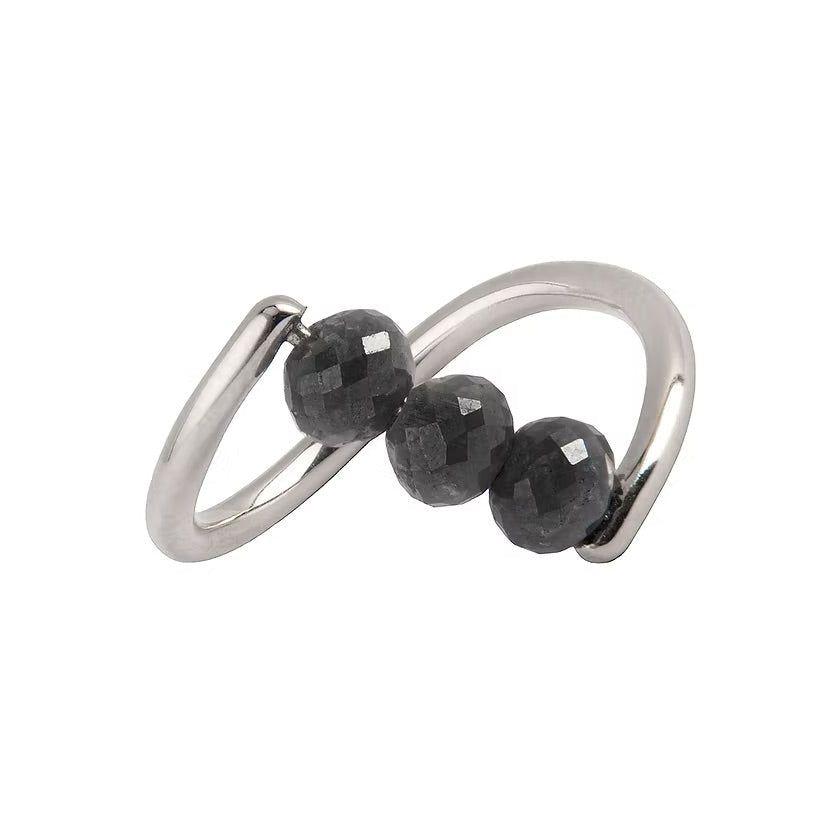 A white gold ring featuring three faceted dark gray diamond beads set along a curved, open infinity-style band, shown on a plain white background.