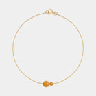 Gold bracelet with two asymmetrical Baltic ambers by Adele Notes.