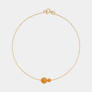 Gold bracelet with two asymmetrical Baltic ambers by Adele Notes.