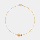 Gold bracelet with two asymmetrical Baltic ambers by Adele Notes.